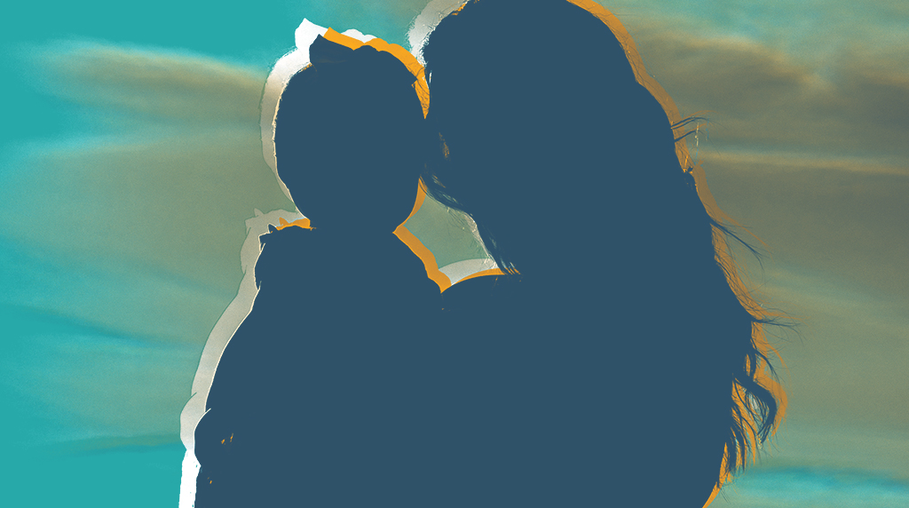 Silhouette of a woman holding a child against a soft, multi-coloured sky in hues of teal and orange.