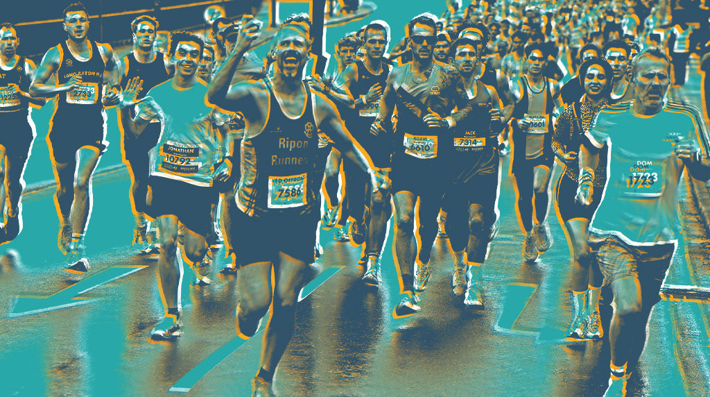 Marathon runners move down a wet street, faces determined and joyful, sharing camaraderie.