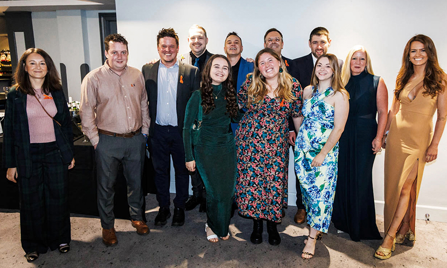 Members of the Harmless team dressed in formal attire.